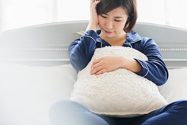 不調を感じる女性